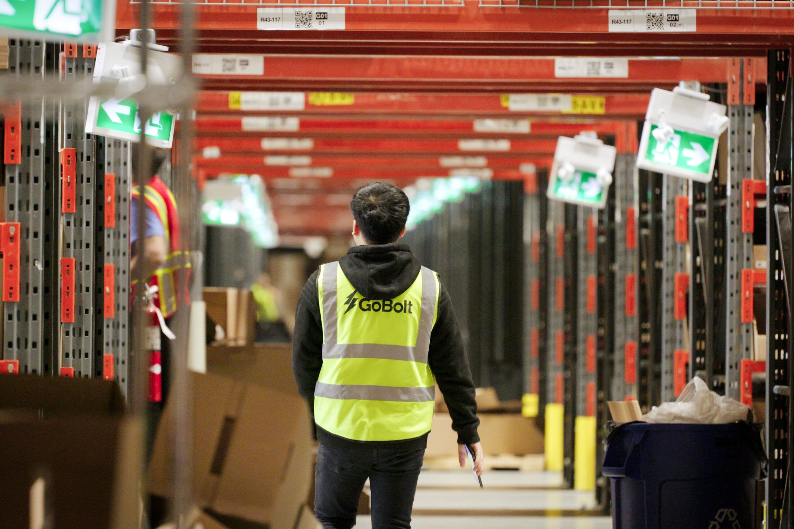 A GoBolt 3PL warehouse employee walking through the warehouse preparing for ecommerce peak season