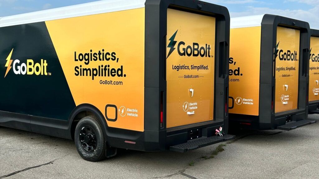 GoBolt Parcel EV delivery vehicles parked in a parking lot, getting ready to make sustainable deliveries.